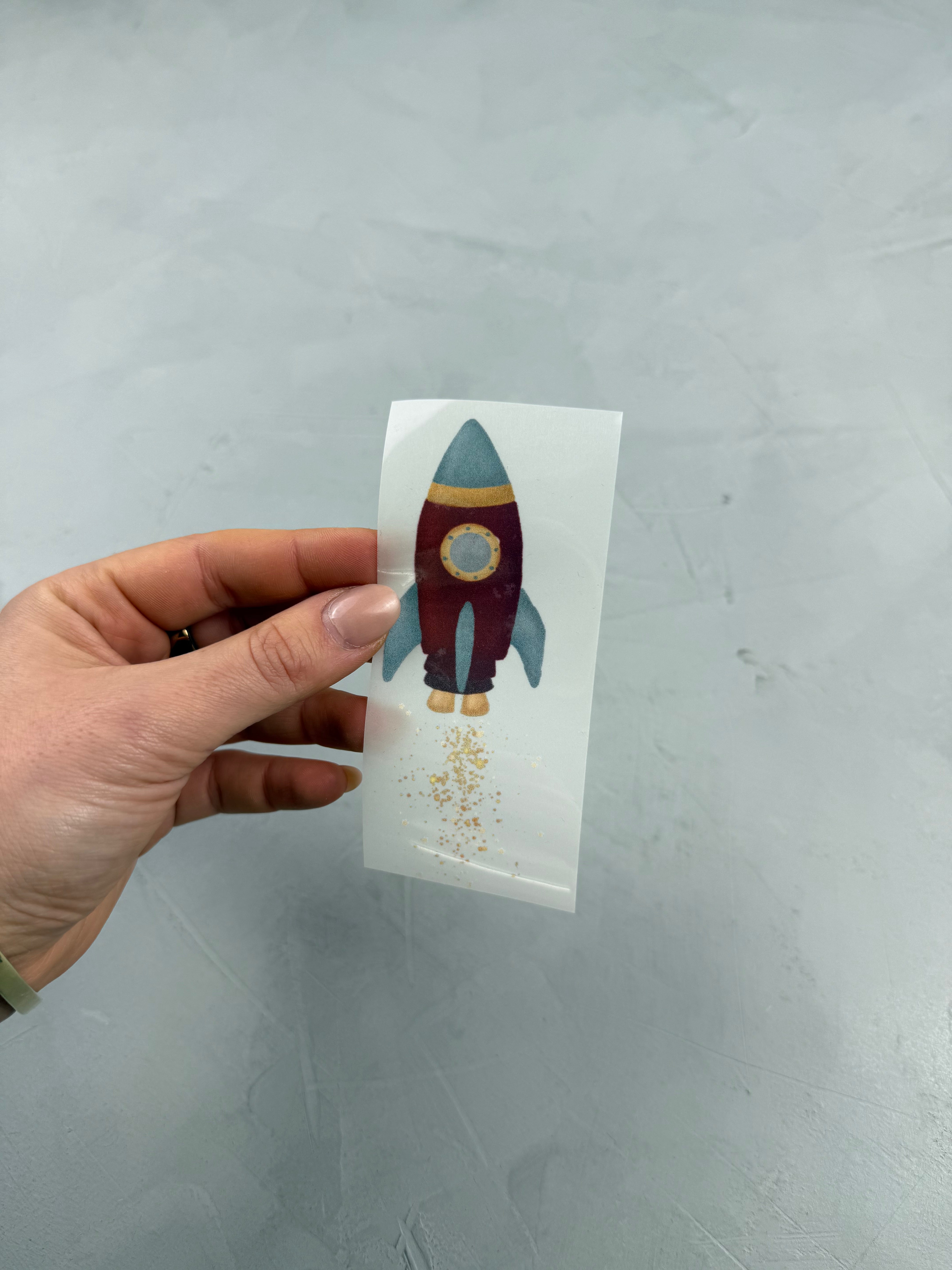 kleines Reflektor-Bügelbild - Raketenstart/Rot