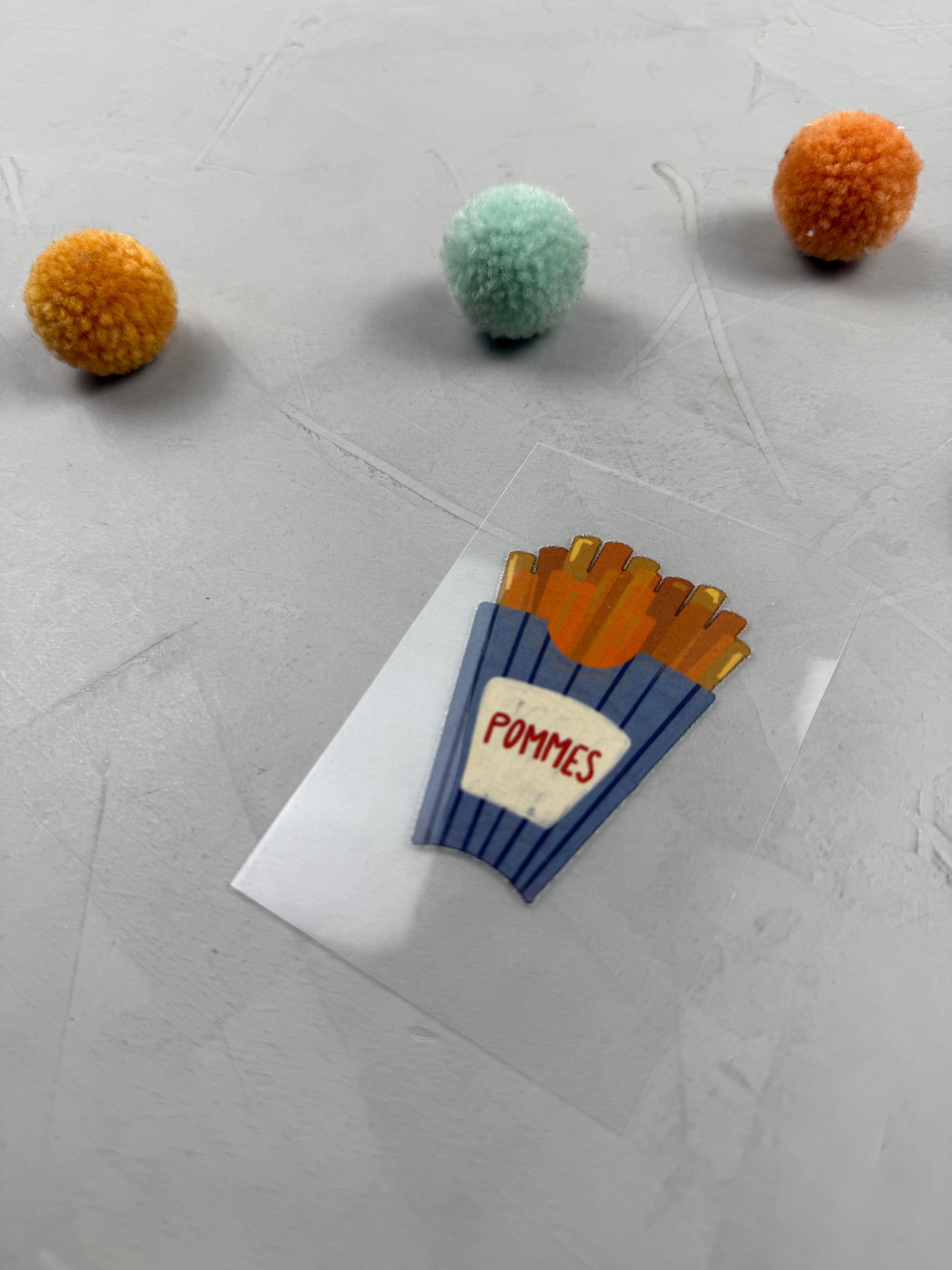 kleines Bügelbild -  Inmitten von Fritten