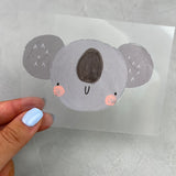 kleines Bügelbild - Koala/Verlegen im Regen